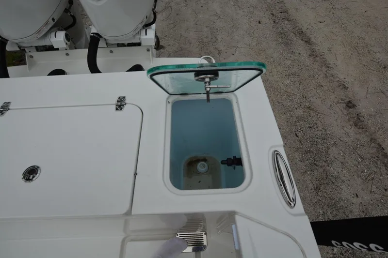 Still Yacht Photos Pics Open hatch on Parker 2420 boat, showcasing storage compartment, 2025 model.