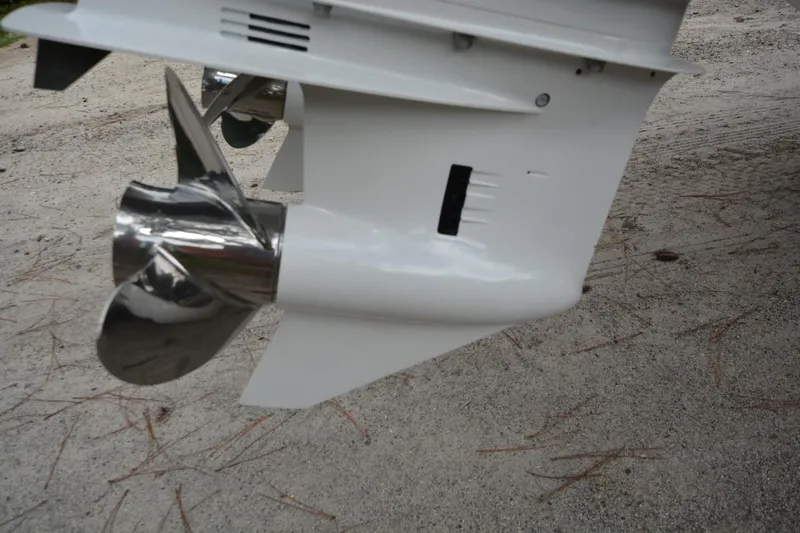 Still Yacht Photos Pics Close-up of a Parker 2420 boat propeller, 2025 model, on sandy ground.