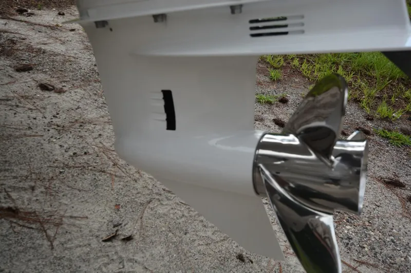 Still Yacht Photos Pics Close-up of a Parker 2420 boat propeller, 2025 model, on a gravel surface.