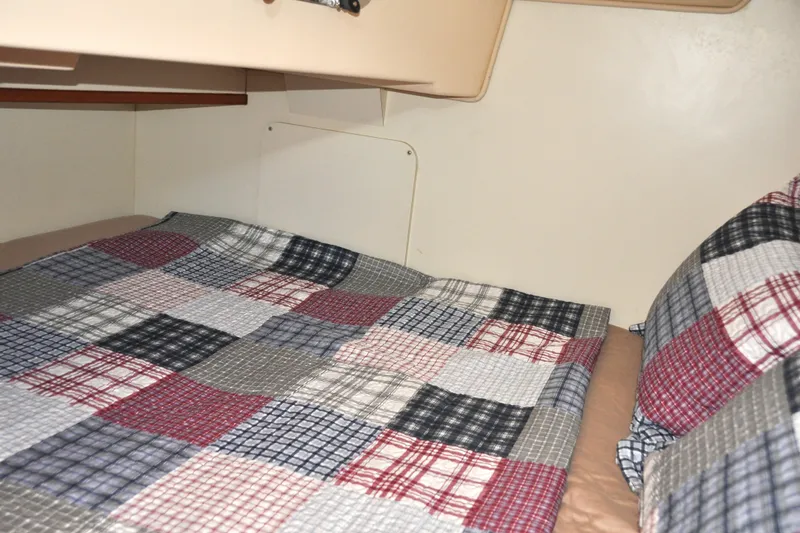 Resolute Yacht Photos Pics Cozy cabin bed with patchwork quilt in 2002 Island Packet 420 sailboat.