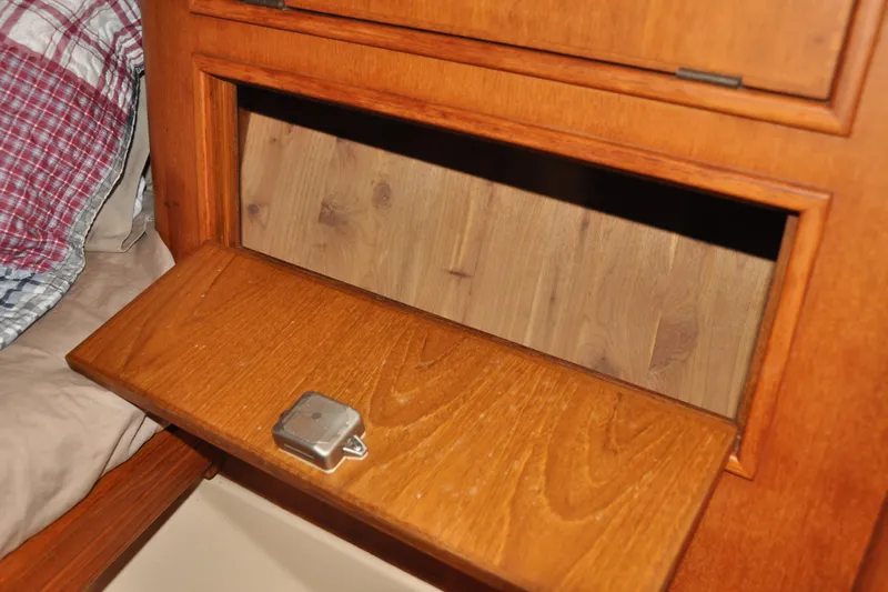 Resolute Yacht Photos Pics Wooden storage compartment on 2002 Island Packet 420 sailboat interior.