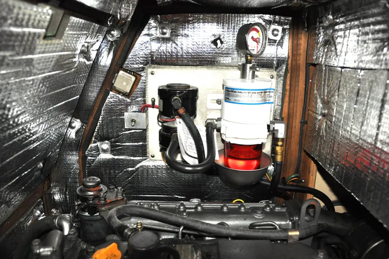 Resolute Yacht Photos Pics Engine compartment of 2002 Island Packet 420 sailboat with fuel filter and insulation.