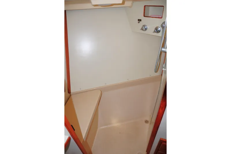 Resolute Yacht Photos Pics 2002 Island Packet 420 shower area with beige interior and chrome fixtures.