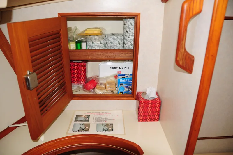 Resolute Yacht Photos Pics Cabinet with first aid kit and supplies on 2002 Island Packet 420 yacht.