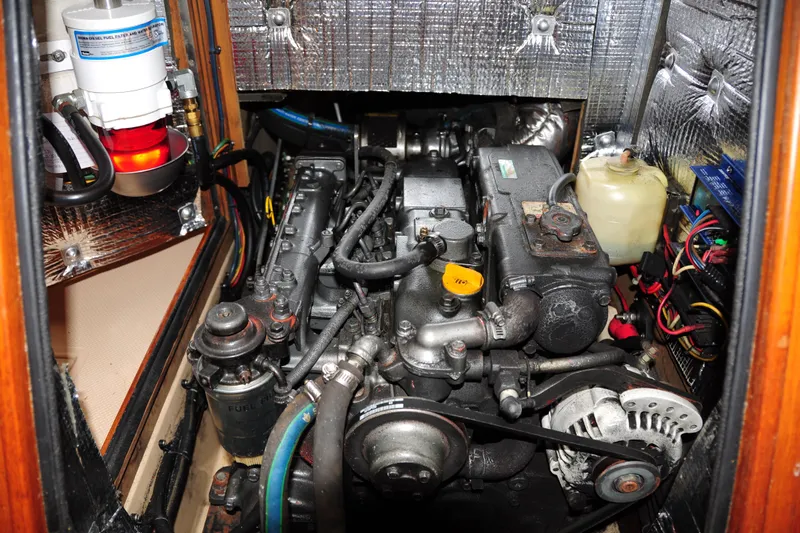 Resolute Yacht Photos Pics Engine compartment of a 2002 Island Packet 420 sailboat, showcasing detailed mechanical components.