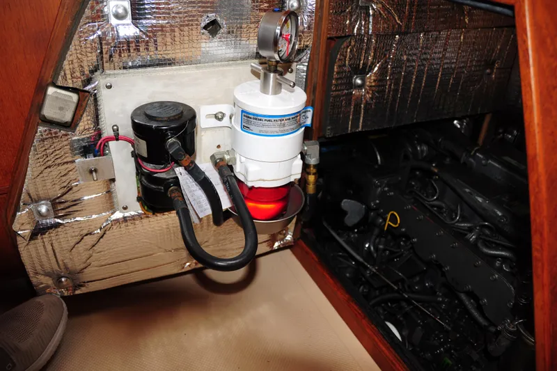Resolute Yacht Photos Pics Engine compartment of 2002 Island Packet 420 sailboat with fuel filter and insulation.
