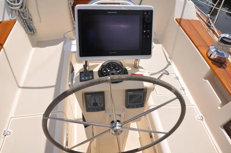 Resolute Yacht Photos Pics Steering wheel and navigation equipment on 2002 Island Packet 420 sailboat.