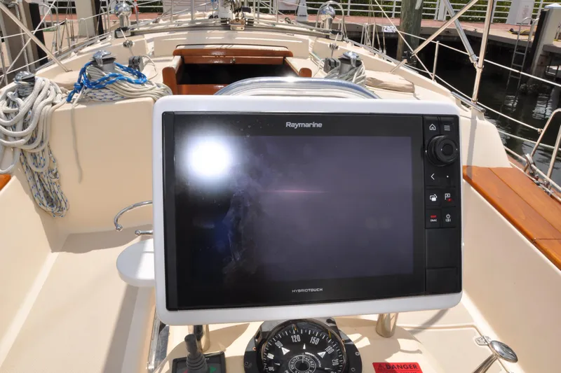 Resolute Yacht Photos Pics Raymarine navigation system on 2002 Island Packet 420 sailboat, with ropes and compass visible.