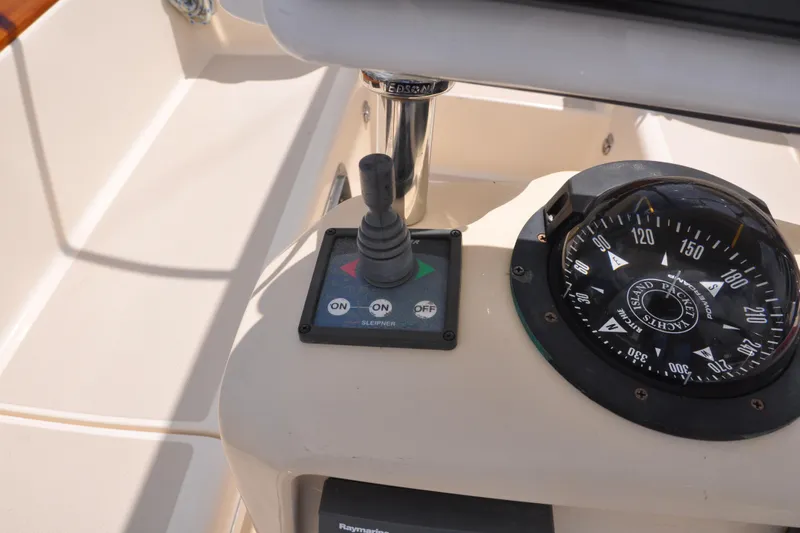 Resolute Yacht Photos Pics Control panel and compass on a 2002 Island Packet 420 sailboat.