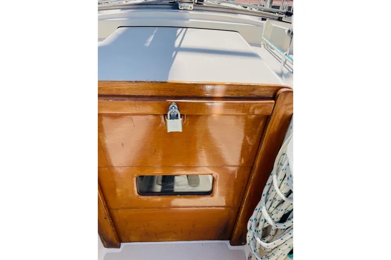 Resolute Yacht Photos Pics Wooden hatch with lock on 2002 Island Packet 420 sailboat deck.