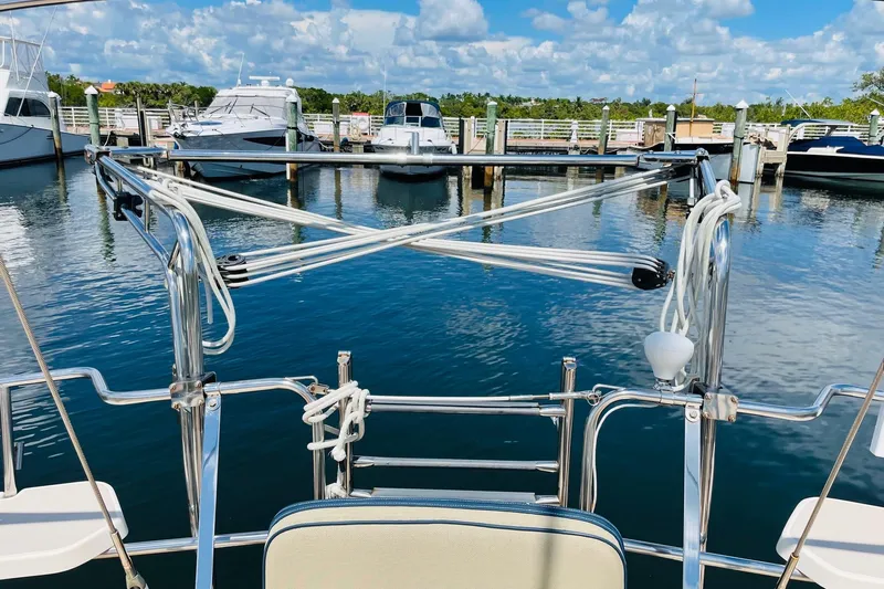 Resolute Yacht Photos Pics Island Packet 420 sailboat docked at marina, clear blue sky, calm water, 2002 model.
