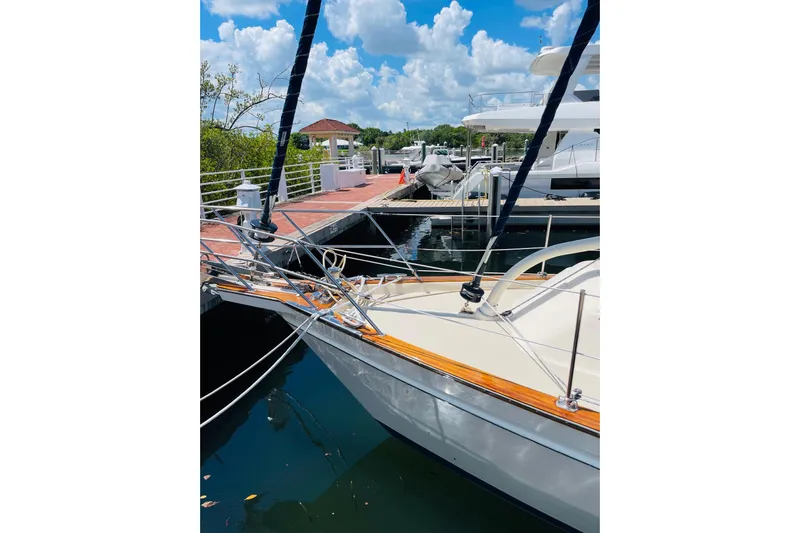 Resolute Yacht Photos Pics Island Packet 420 sailboat docked at marina, 2002 model, under a bright blue sky.