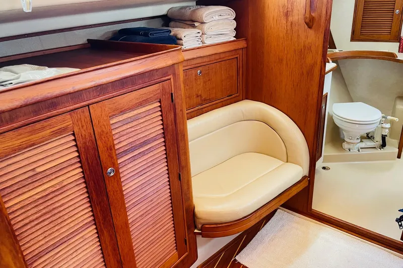 Resolute Yacht Photos Pics Luxurious 2002 Island Packet 420 yacht interior with wooden cabinetry and cozy seating.