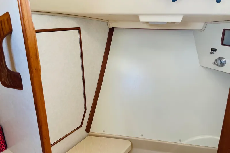Resolute Yacht Photos Pics Interior cabin of 2002 Island Packet 420 sailboat, featuring wood accents and control panel.