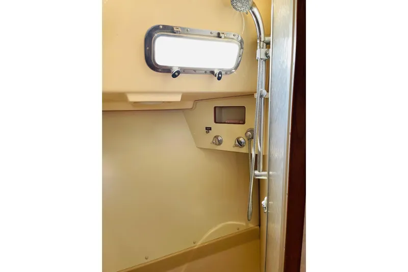 Resolute Yacht Photos Pics Shower area in 2002 Island Packet 420 yacht with window and controls.