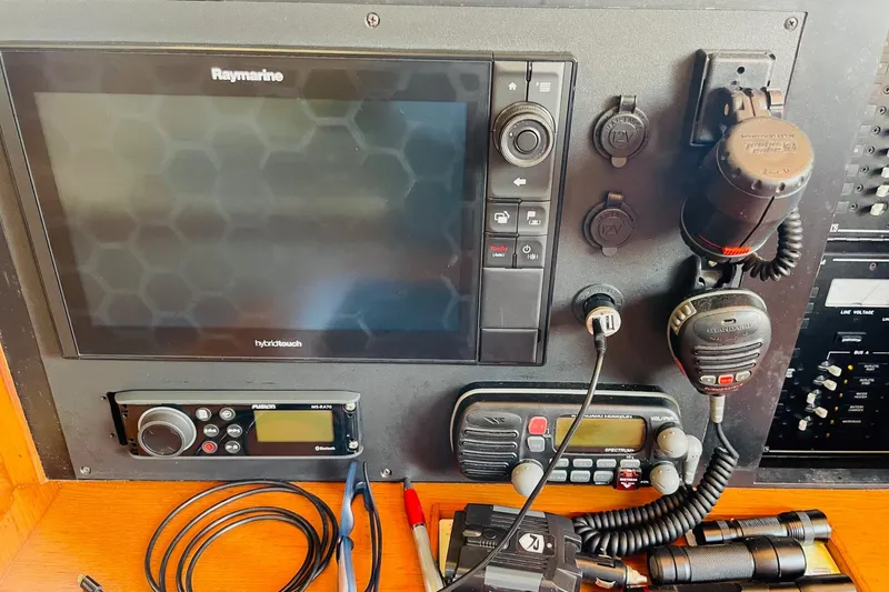 Resolute Yacht Photos Pics Control panel of a 2002 Island Packet 420 sailboat with navigation and communication equipment.