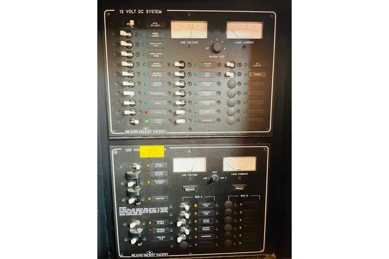 Resolute Yacht Photos Pics Electrical control panel of a 2002 Island Packet 420 yacht, featuring 12V and 120V systems.