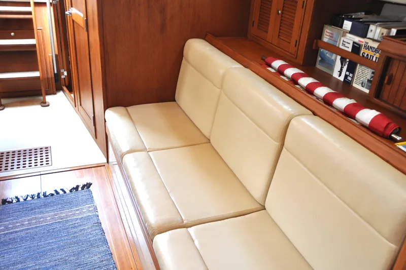 Resolute Yacht Photos Pics Interior of 2002 Island Packet 420 yacht with beige seating and wooden cabinetry.