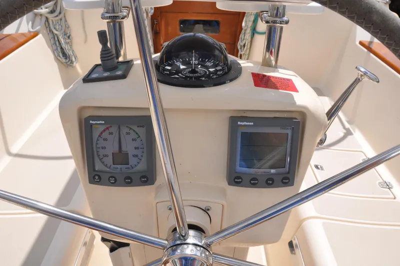Resolute Yacht Photos Pics Steering console of 2002 Island Packet 420 sailboat with navigation instruments.