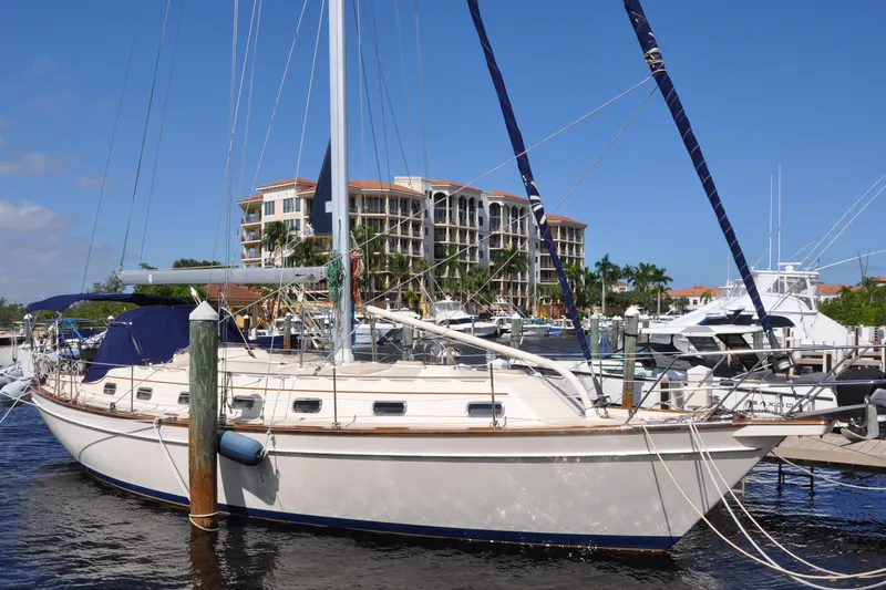Resolute Yacht Photos Pics 2002 Island Packet 420 sailboat docked at marina with waterfront buildings.