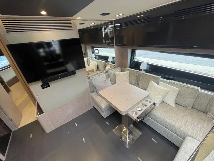  Yacht Photos Pics Luxurious interior of 2018 Azimut Atlantis 51 yacht with modern seating and large TV.