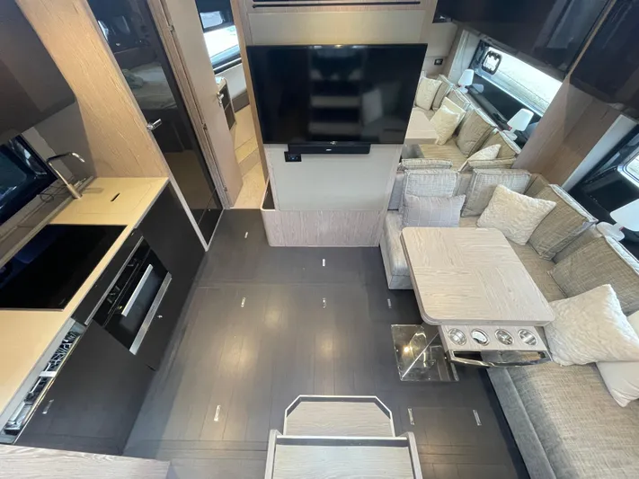  Yacht Photos Pics Luxurious interior of 2018 Azimut Atlantis 51 yacht with modern kitchen and seating area.
