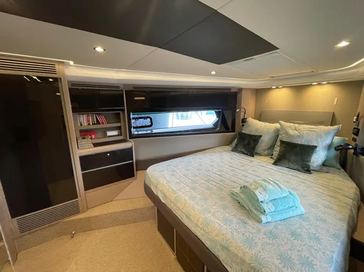  Yacht Photos Pics Luxurious bedroom interior of 2018 Azimut Atlantis 51 yacht with modern decor.