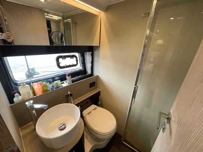  Yacht Photos Pics Luxurious bathroom in 2018 Azimut Atlantis 51 yacht with modern fixtures and shower.