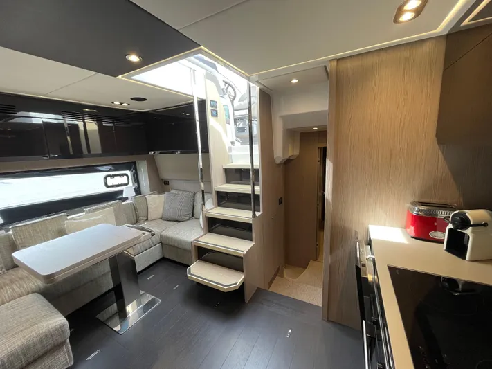  Yacht Photos Pics Luxurious interior of 2018 Azimut Atlantis 51 yacht with modern kitchen and seating area.