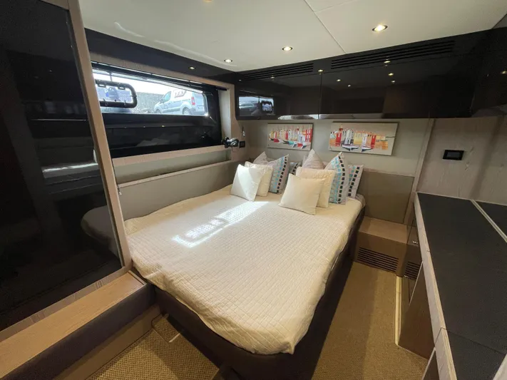 Yacht Photos Pics Luxurious bedroom interior of 2018 Azimut Atlantis 51 yacht with modern design and cozy bedding.