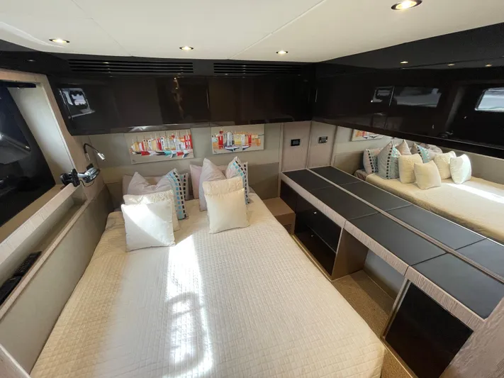  Yacht Photos Pics Luxurious bedroom interior of 2018 Azimut Atlantis 51 yacht with modern design and plush bedding.