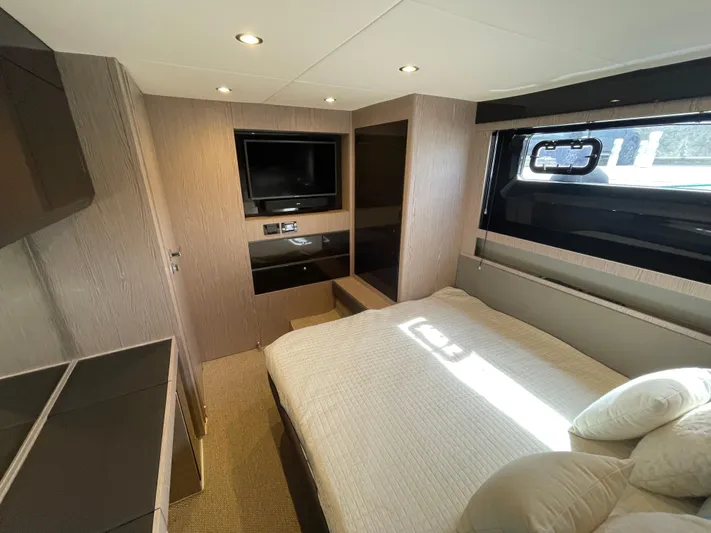  Yacht Photos Pics Luxurious bedroom interior of 2018 Azimut Atlantis 51 yacht with modern design and natural light.