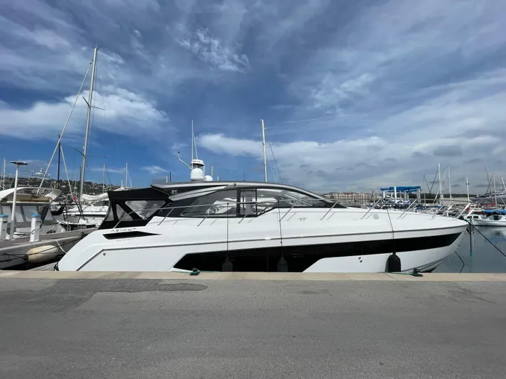 Yacht Photos Pics 2018 Azimut Atlantis 51 yacht docked at marina under blue sky.