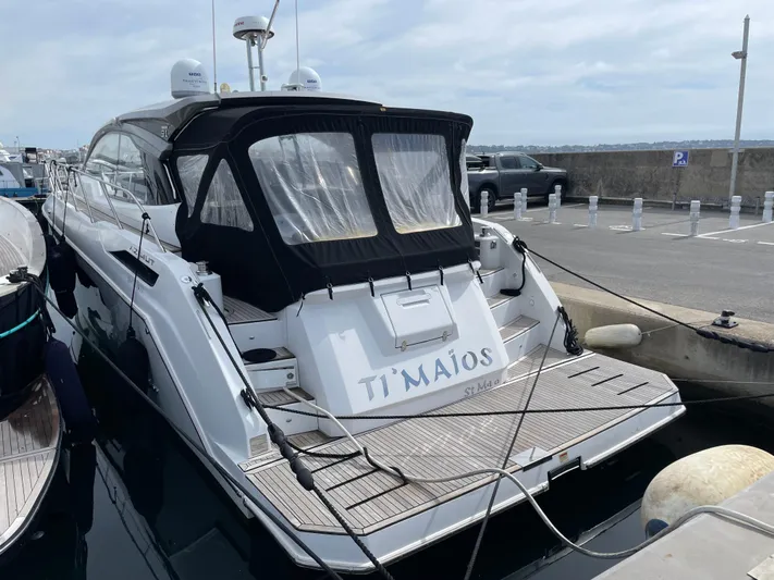  Yacht Photos Pics 2018 Azimut Atlantis 51 yacht docked at a marina, rear view.
