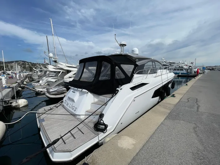 Yacht Photos Pics 2018 Azimut Atlantis 51 yacht docked at marina under cloudy sky.