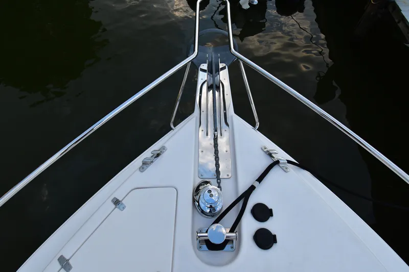Promesa Yacht Photos Pics Bow of 2021 Hylas M44 yacht with anchor chain and railing.