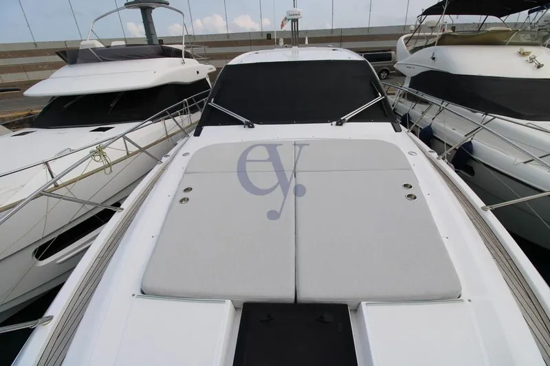  Yacht Photos Pics 2022 Azimut Atlantis 51 yacht, docked, showcasing sleek design and spacious deck.