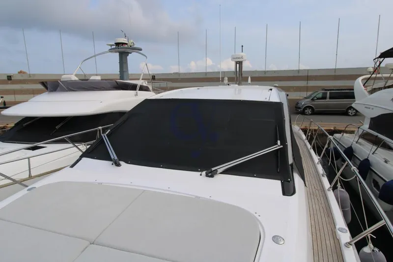  Yacht Photos Pics Azimut Atlantis 51 yacht, 2022 model, docked at a marina with covered windshield.