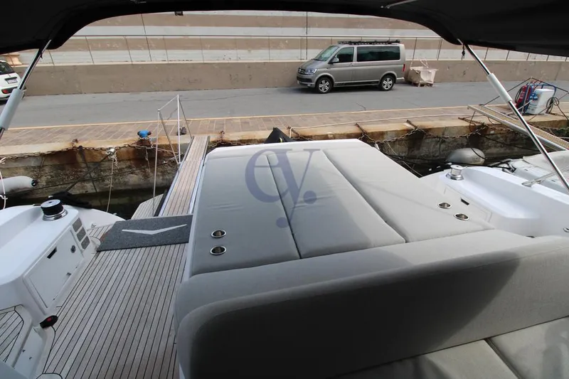  Yacht Photos Pics 2022 Azimut Atlantis 51 yacht with spacious deck and luxurious seating at dockside.