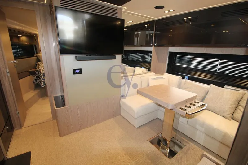  Yacht Photos Pics Luxurious interior of 2022 Azimut Atlantis 51 yacht with modern seating and entertainment area.