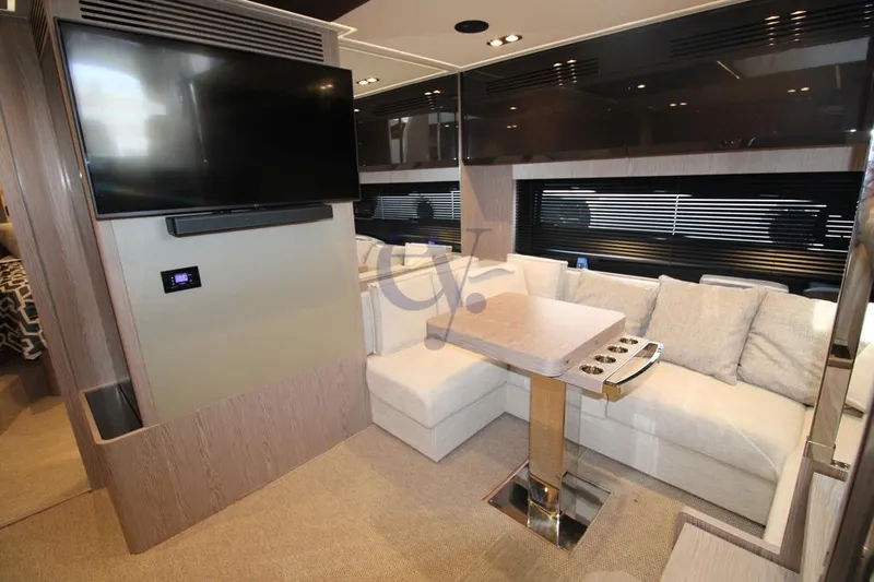  Yacht Photos Pics Luxurious interior of 2022 Azimut Atlantis 51 yacht with modern seating and entertainment area.