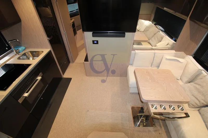  Yacht Photos Pics Luxurious interior of 2022 Azimut Atlantis 51 yacht with modern kitchen and seating area.