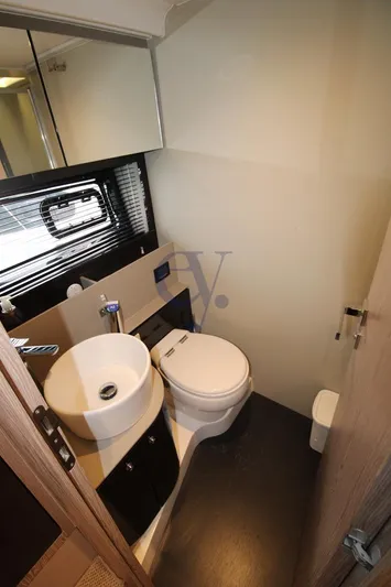  Yacht Photos Pics Bathroom interior of 2022 Azimut Atlantis 51 yacht, featuring modern sink and toilet.