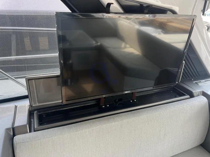  Yacht Photos Pics Flat-screen TV on 2022 Azimut Atlantis 51 yacht, interior view.