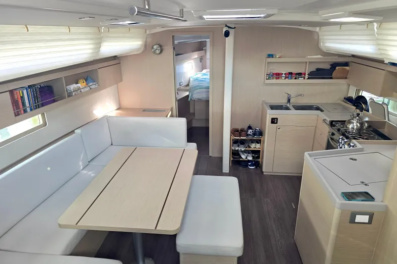 Sophia Yacht Photos Pics Interior of 2022 Beneteau Oceanis 40.1 yacht with modern kitchen and dining area.