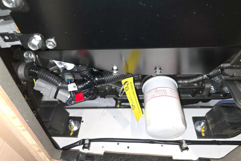 Sophia Yacht Photos Pics Engine compartment of a 2022 Beneteau Oceanis 40.1 sailboat, showing wiring and filter.