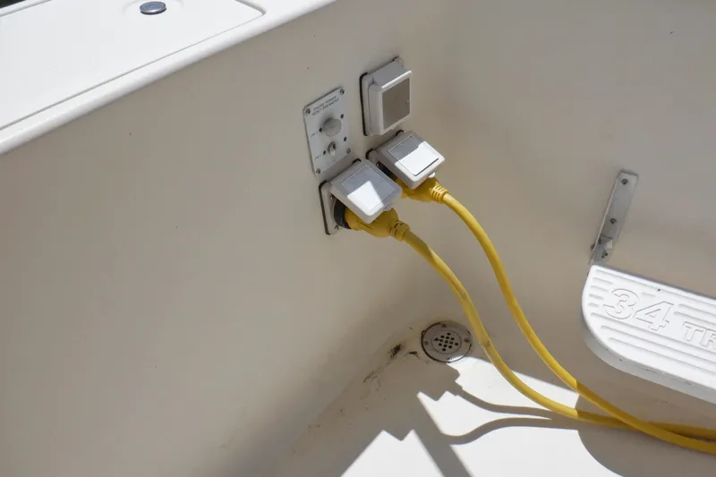 Betty Sue Yacht Photos Pics Electrical outlets and yellow cables on a 2006 Mainship 34 Trawler boat.