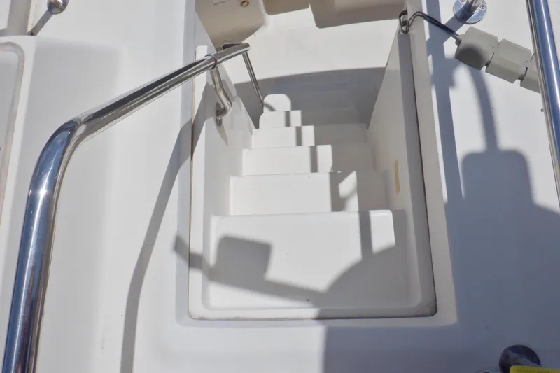 Betty Sue Yacht Photos Pics Staircase on 2006 Mainship 34 Trawler with stainless steel handrails.