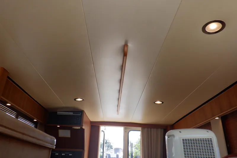 Betty Sue Yacht Photos Pics Interior ceiling of 2006 Mainship 34 Trawler with recessed lighting and wood accents.