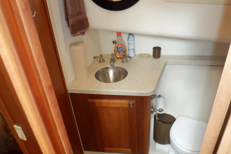 Betty Sue Yacht Photos Pics 2006 Mainship 34 Trawler bathroom with sink, countertop, and toilet.